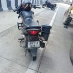 A husband and wife died in a tractor-bike collision on the Paithana overbridge; the driver is absconding; an investigation is underway.